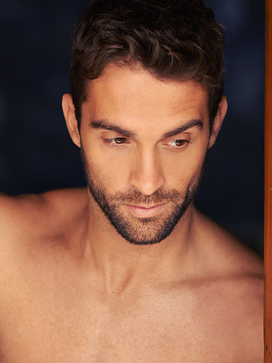 Man with short hair and beard, deep in thought.