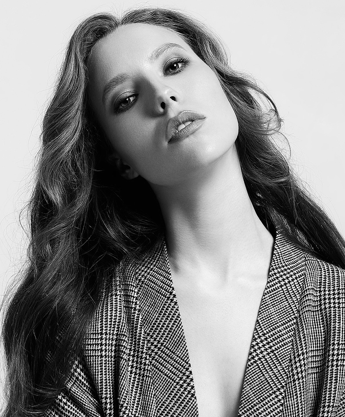 Black and white portrait of a confident woman.