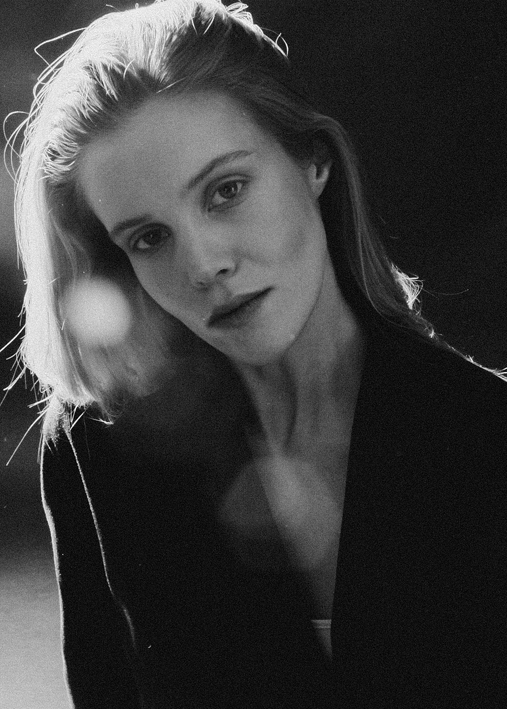 Black and white portrait of a contemplative woman.