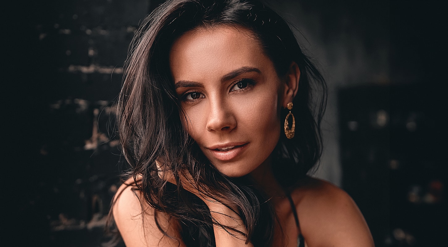 Portrait of a woman with long dark hair.
